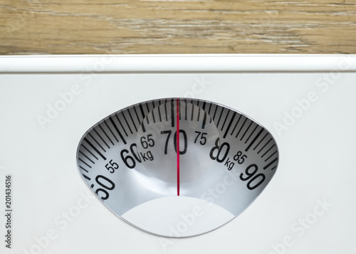 Closeup of weight scales overweight and obesity concept