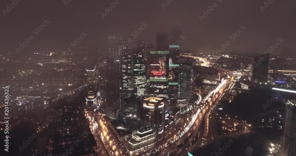Aerial night illuminated view of city blocks and road systems in a developing city, Moscow, Russia. Development, illumination, lifestyle concept. Aerial night illuminated view of city blocks and road systems in a developing city, Moscow, Russia. Development, illumination, lifestyle concept.