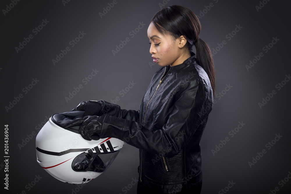 Black female motorcycle rider or race car driver wearing a racing