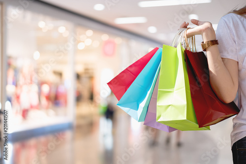 Closeup of woman holding shopping colorful of shopping bags at shopping mall with copy space - Shopping Concept