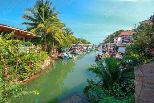 Group of fishing boats docked at the Port of river in fisherman village