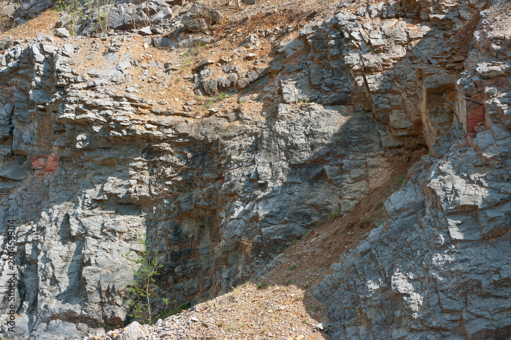 A close-up view of the walls of an old abandoned quarry. In this quarry, limestone was mined.