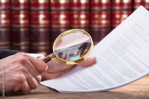 Human Hand Examining Document