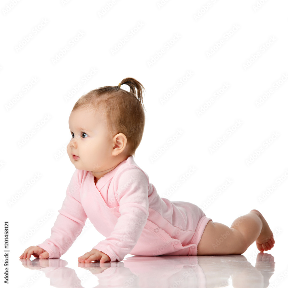 8 month infant child baby girl toddler lying in white shirt looking up 8 month infant child baby girl toddler lying in white shirt looking up