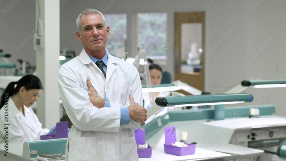 Scientist looking at camera in a laboratory Scientist looking at camera in a laboratory