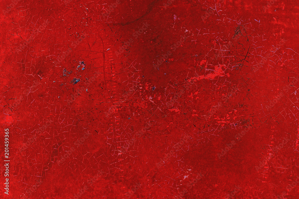Textured metal surface carelessly colored red paint