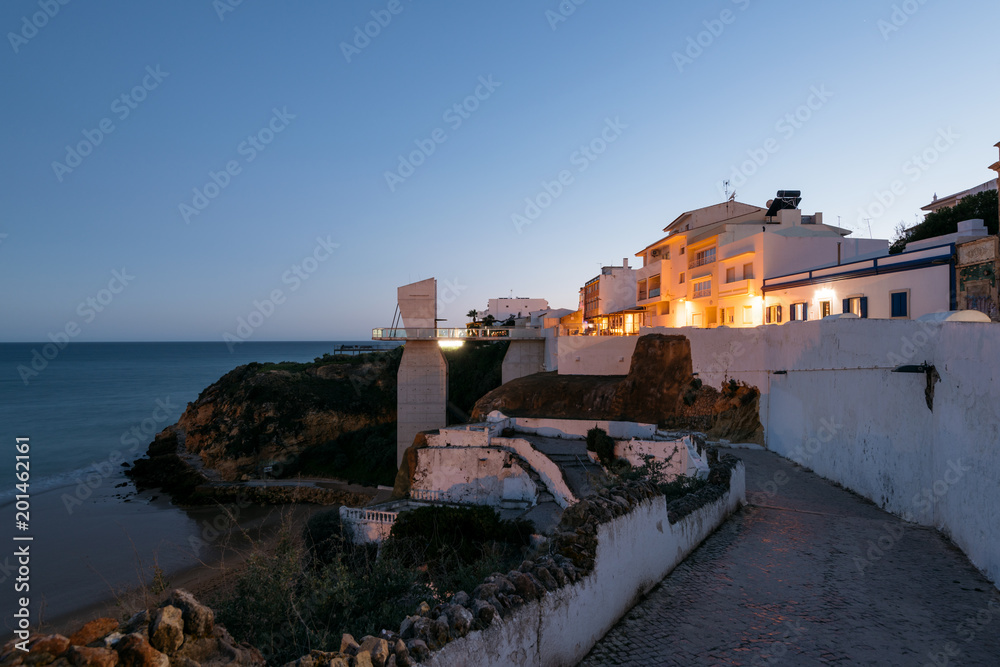 Night view of cliffside buildiings of the Albufeira town in Algarve, Portugal. 