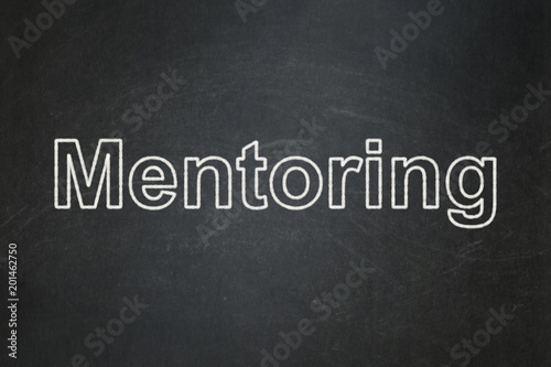 Education concept: text Mentoring on Black chalkboard background