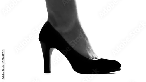 Womans leg in high heels stepping on small weak man, female dominating in couple