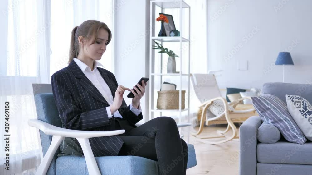 Woman Using Smartphone, Browsing online at Work Woman Using Smartphone, Browsing online at Work
