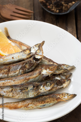 Grilled fish capelin or shishamo on white plate