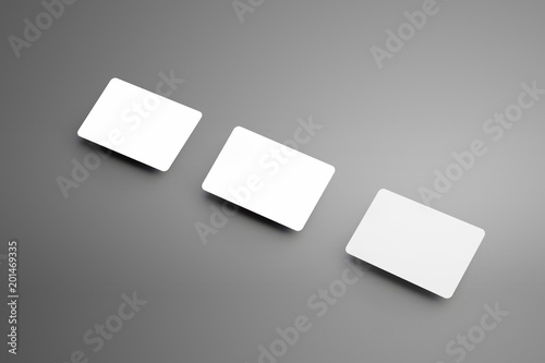 Stylish white mockup of a three bank (gift) card placed diagonally on a background.