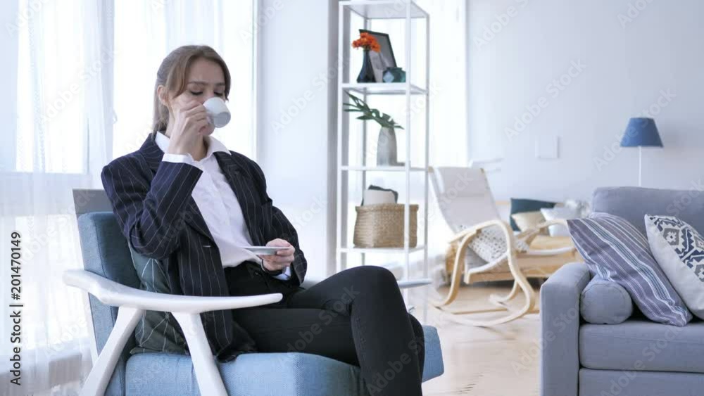 Woman Drinking Coffee while Sitting on Sofa Woman Drinking Coffee while Sitting on Sofa