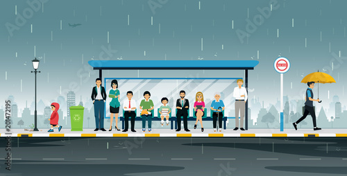 People are waiting at the bus stop when it rains.