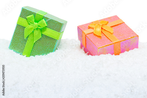 Two square gift boxes in snow photo