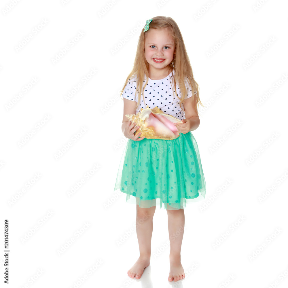 Little girl with sea shell Little girl with sea shell