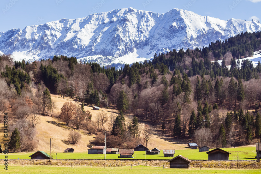 Farm houses with magnificent mountains in background