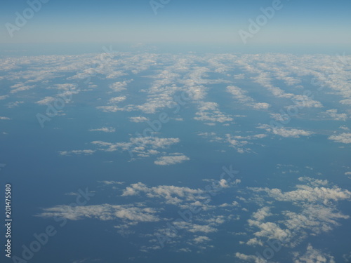 Blue sky and scenery of cloud formation panorama as seen through window of an aircraft above Europe © Jakub Korczyk