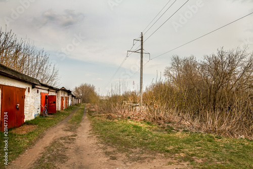 The road passing along the old car garages