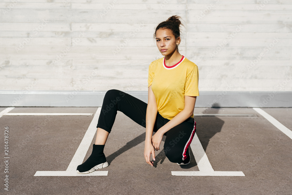 Fit woman on parking lot Fit woman on parking lot