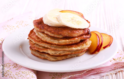 Banana pancakes with fruits on top