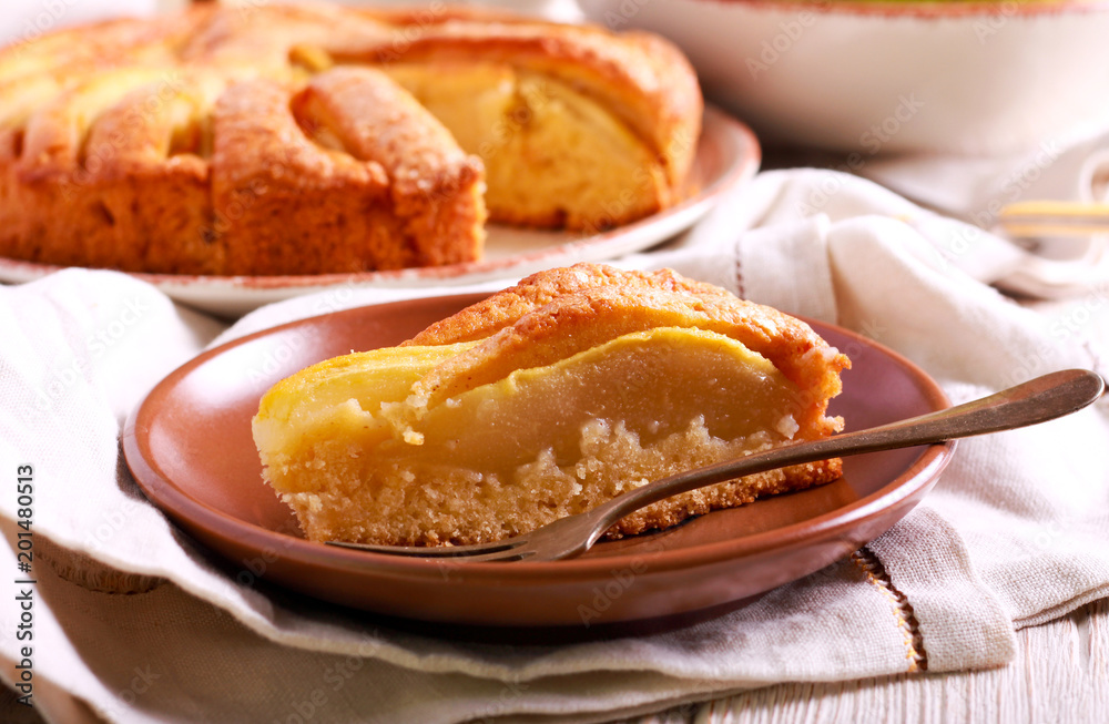 Pear cake, sliced and served