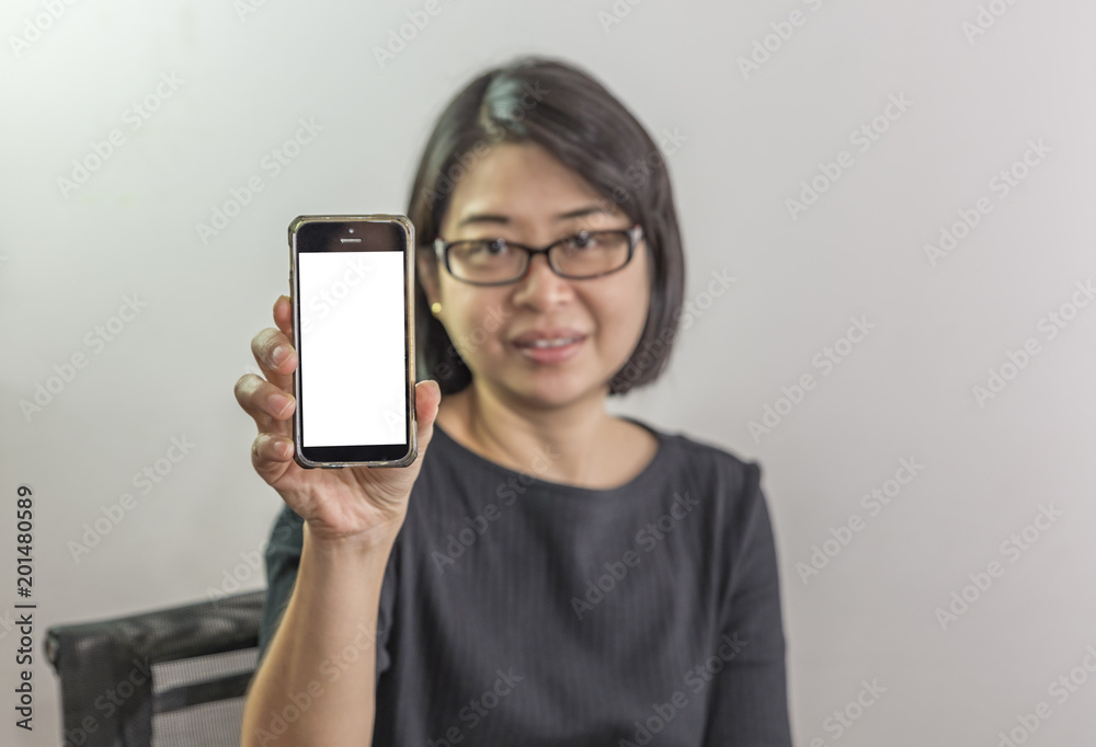Asian woman showing blank mobile phone
