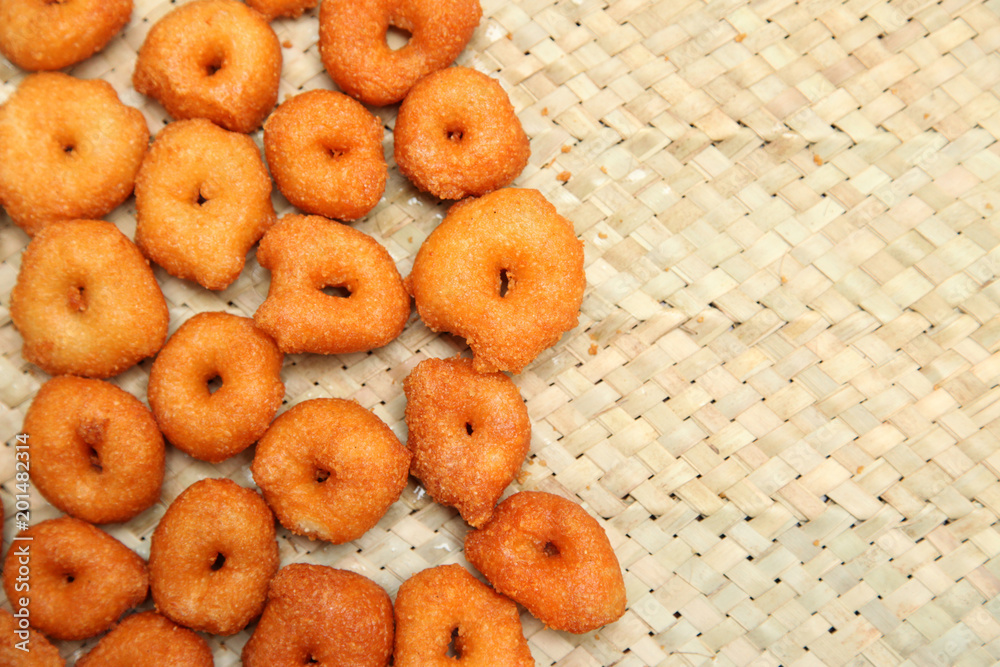 Deep frying medu vada in the pan. Medu Vada is a savoury snack from South India, very common street food in the India.