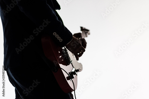 Man acoustic guitar player. Closeup guitarist silhouette isolated on white background