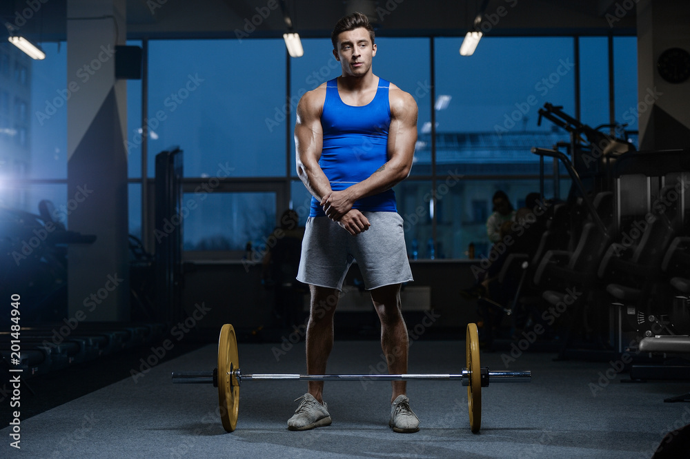 Handsome model young man workout in gym Handsome model young man workout in gym