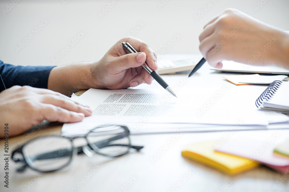 Two high school students campus or classmates with helps friend studying for a test an exam in workbook learning in classroom, Tutor books with friends, Education school concept Two high school students campus or classmates with helps friend studying for a test an exam in workbook learning in classroom, Tutor books with friends, Education school concept