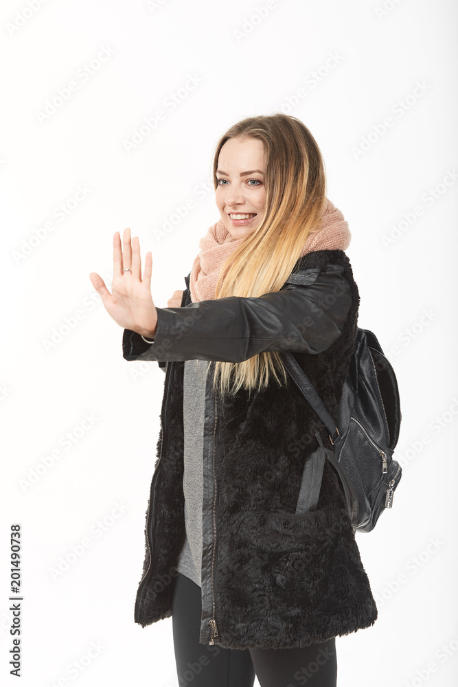 A girl in demi-season clothes with a bag on a white background. A girl in demi-season clothes with a bag on a white background.