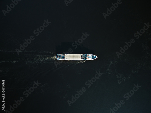 aerial view of excursion boat with passengers on river