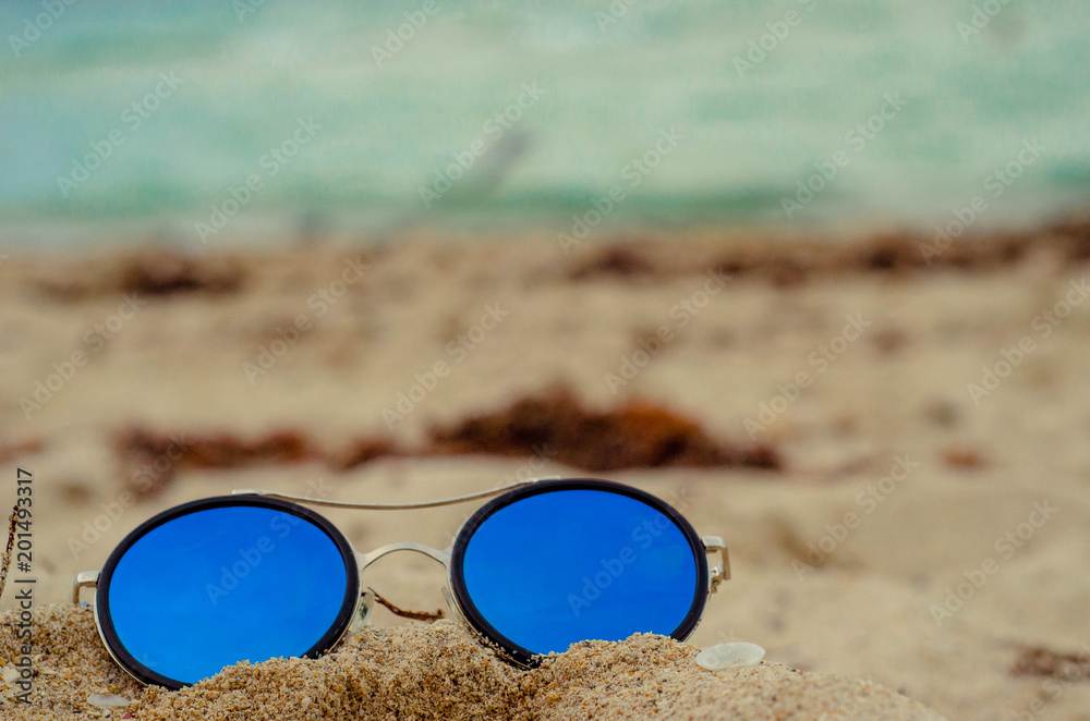 glasses on sand