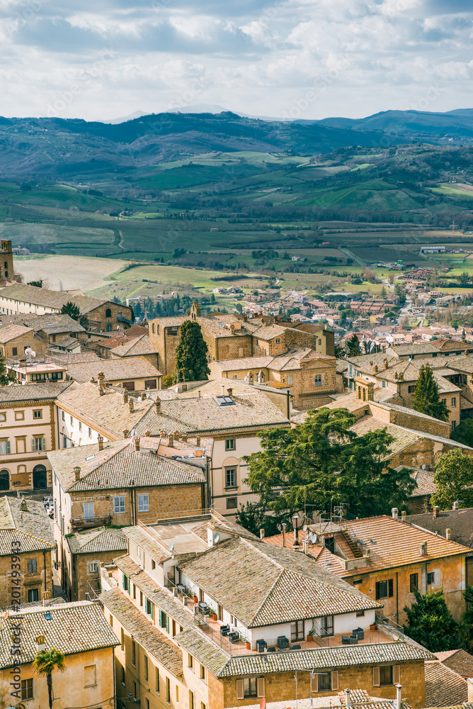 aerial view of buildings and hills on background in Orvieto, Rome suburb, Italy