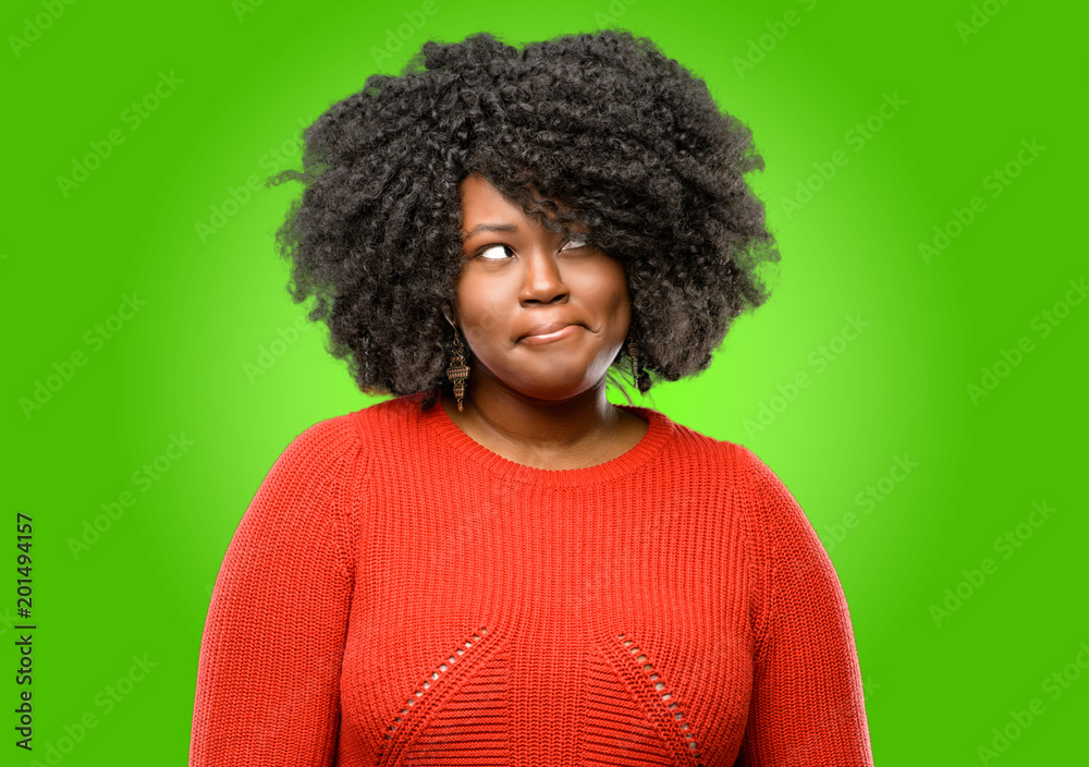 Beautiful african woman doubt expression, confuse and wonder concept, uncertain future Beautiful african woman doubt expression, confuse and wonder concept, uncertain future