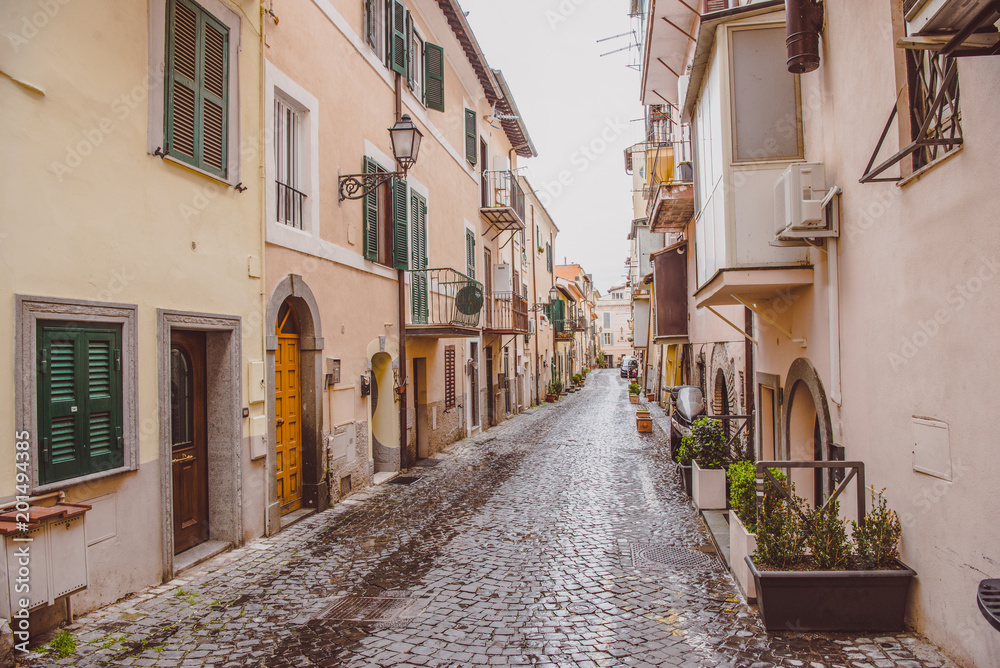 narrow street with buildings in Castel Gandolfo, Rome suburb, Italy