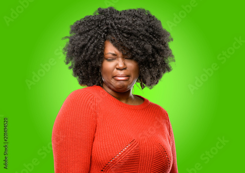 Beautiful african woman crying depressed full of sadness expressing sad emotion