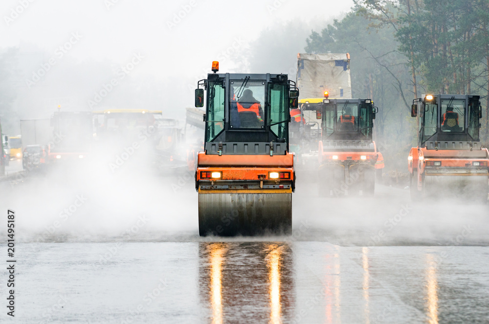 Asphalt laying with many rollers Asphalt laying with many rollers