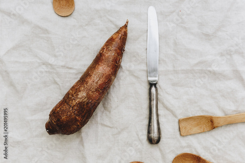 Fresh tapioca, cassava root, mandioca.  aipim cut open, South Indian food, kappa puzhukku, root vegetable Brazil. photo