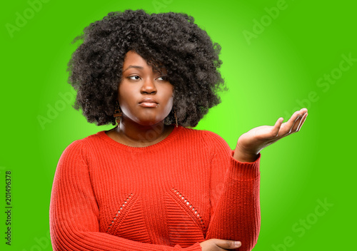 Beautiful african woman irritated and angry expressing negative emotion, annoyed with someone