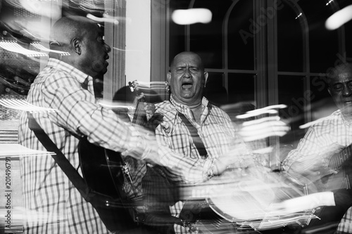 Cuban musical trio acting in the night club photo