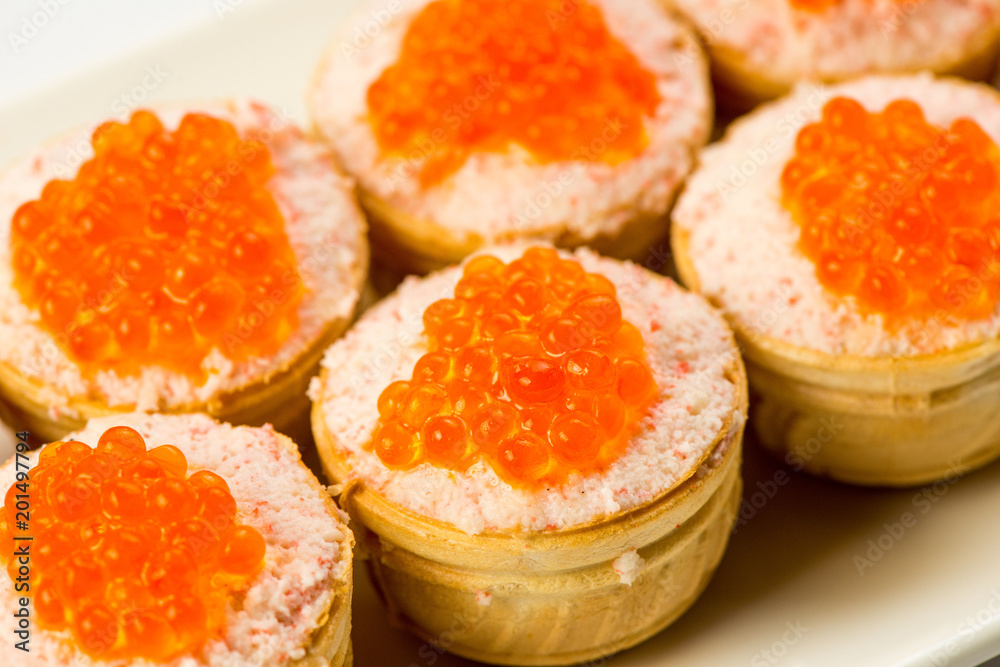 Tartlets with cheese and red caviar. Selective focus. Copy space Tartlets with cheese and red caviar. Selective focus. Copy space