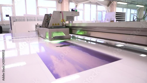 UV printer. The equipment works in the shop. Drawing image