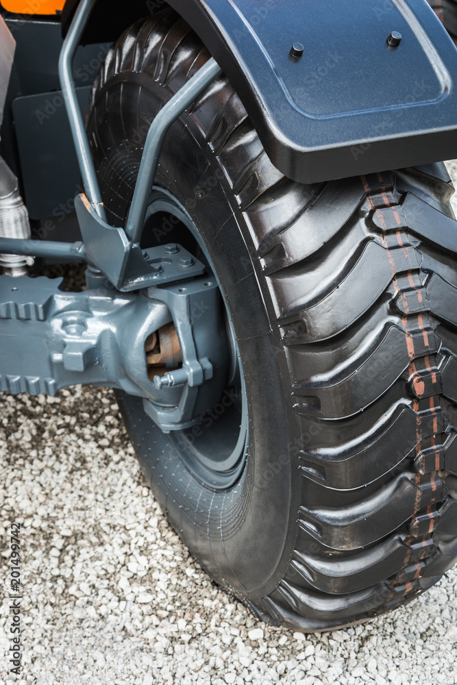 wheel tread of the tractor or excavator. details and parts of construction machinery wheel tread of the tractor or excavator. details and parts of construction machinery