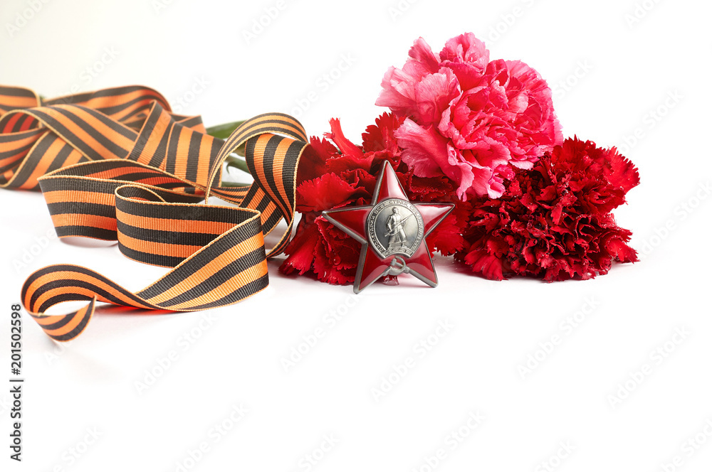 Concept background of May 9 russian holiday Victory Day. Red carnations, St. George's ribbon and order of the Red Star
