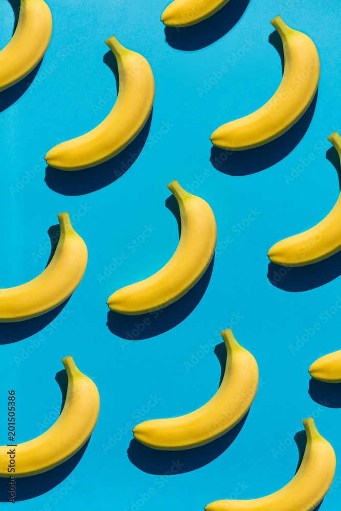 Background with bright bananas on blue