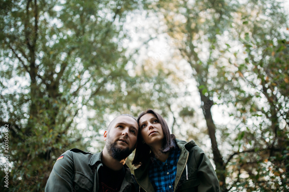 Walk a guy and a girl. Love story in the forest. Youth in nature. Walk a guy and a girl. Love story in the forest. Youth in nature.