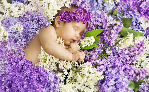 Baby Girl Sleep in Lilac Flowers, Newborn Child Sleeping on Purple Flower Background, Three Months Old Infant Kid Beauty Portrait photo