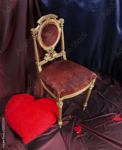 a large red heart and small hearts, an antique chair. Valentine's Day